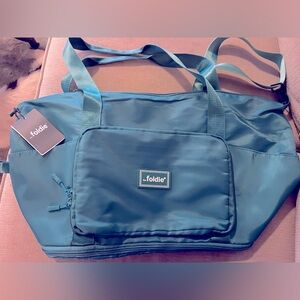 The Foldie Travel Bag- new with tags never used.